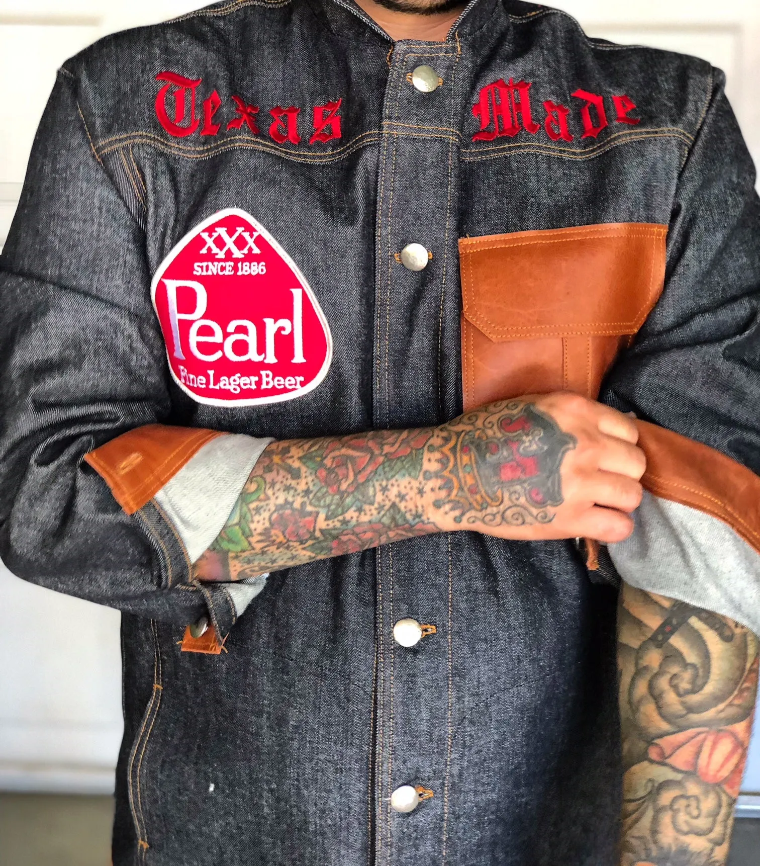 "Texas Made" denim and cognac leather jacket